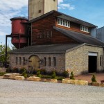 Distillery building, columnar still, grain bin at Willett